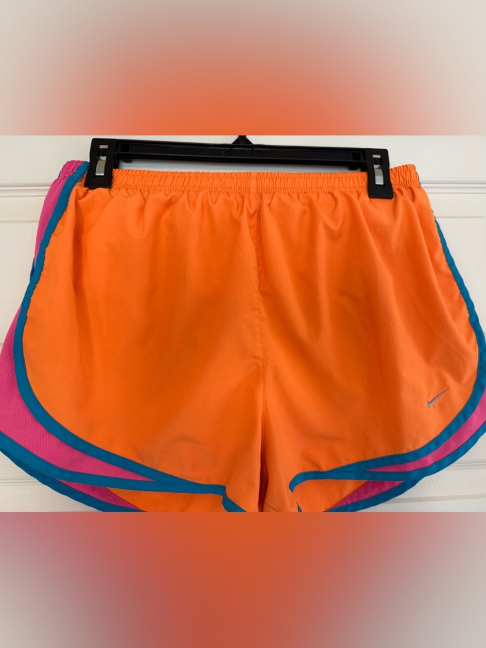 Nike Women's Orange Athletic Shorts with Teal and Pink Trim